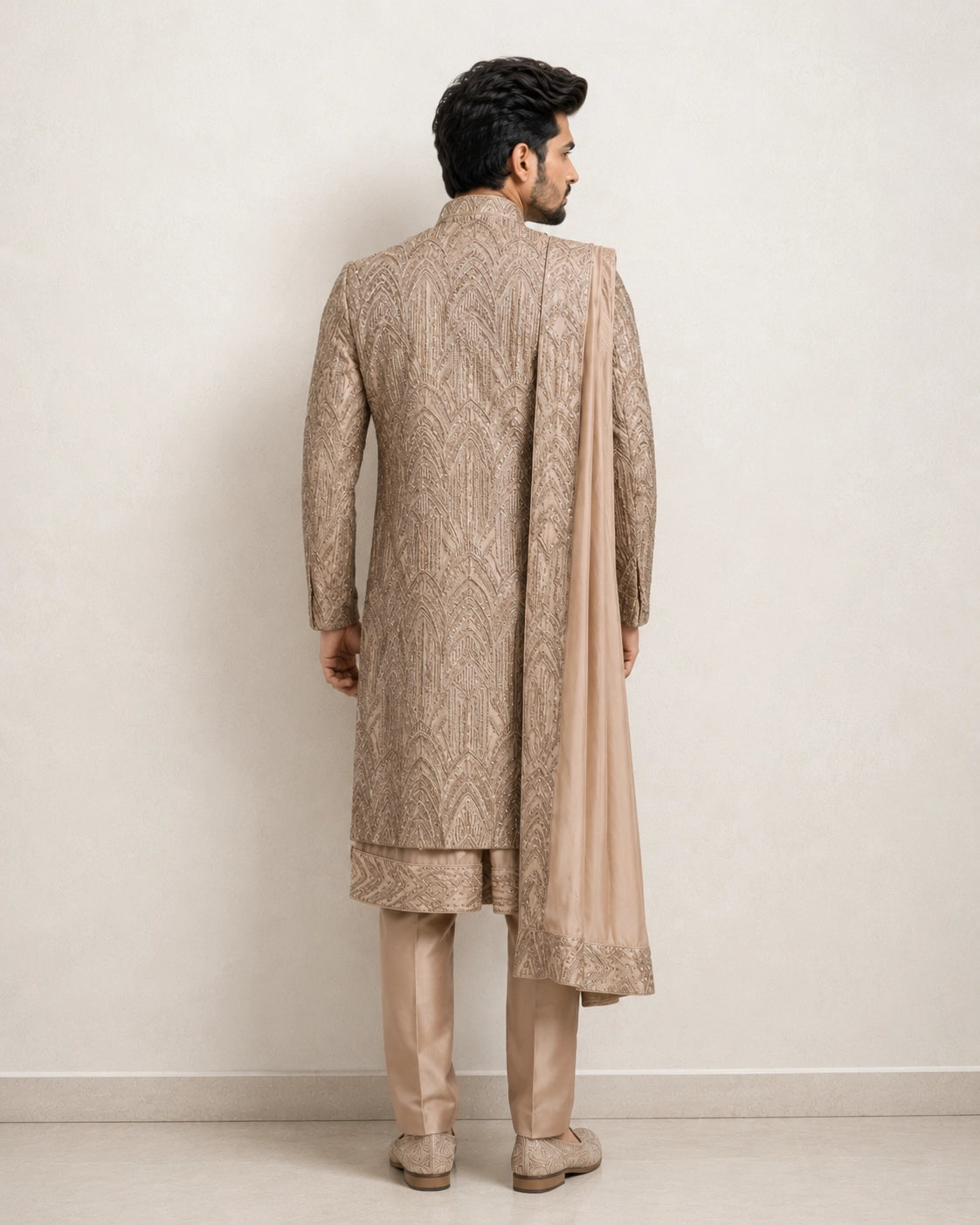 A man wearing an elegant Chikoo Sherwani, perfect for weddings and festive occasions.
