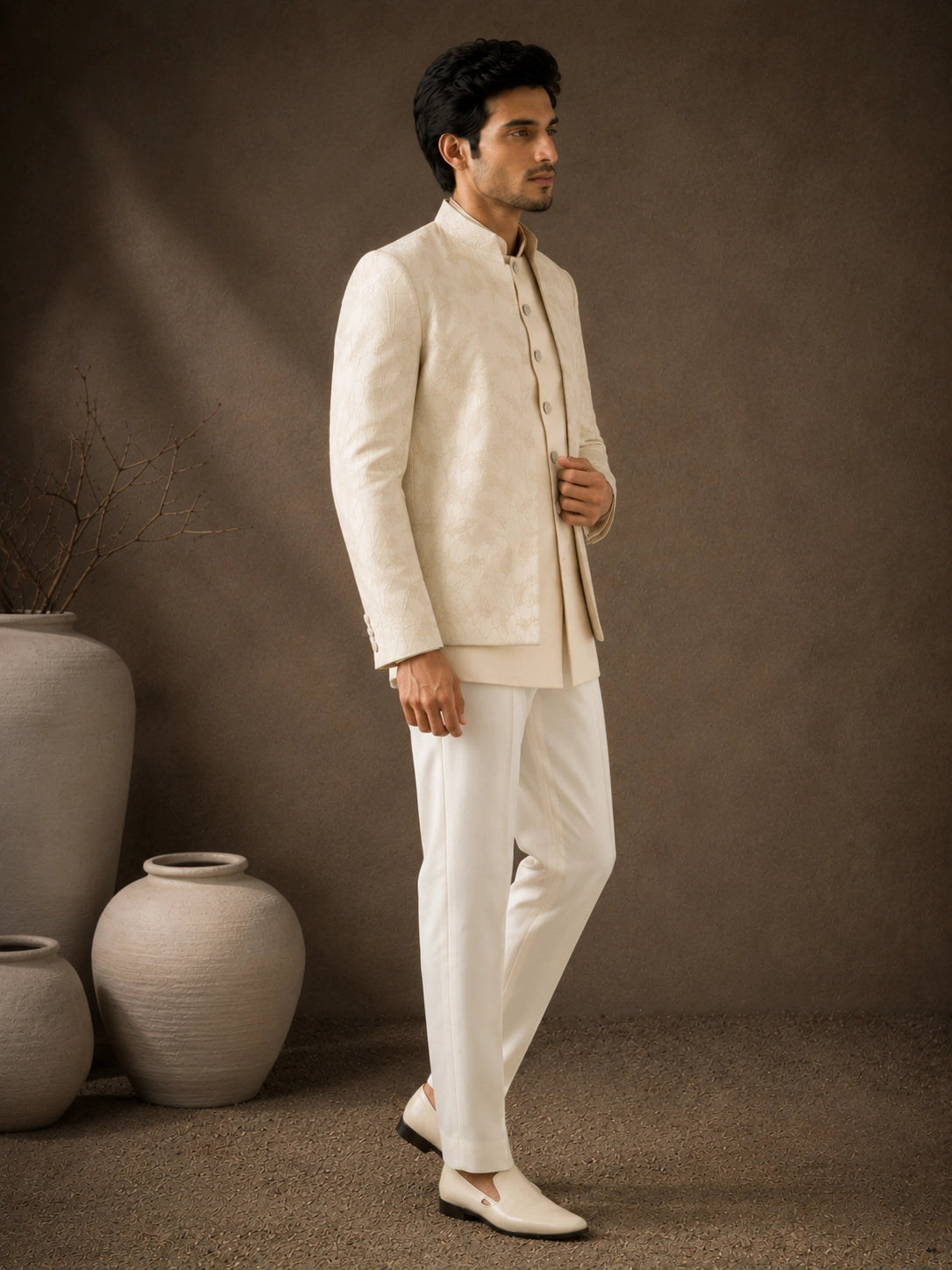 Man wearing a classic white Jodhpuri suit, perfect for formal Indian events and celebrations.