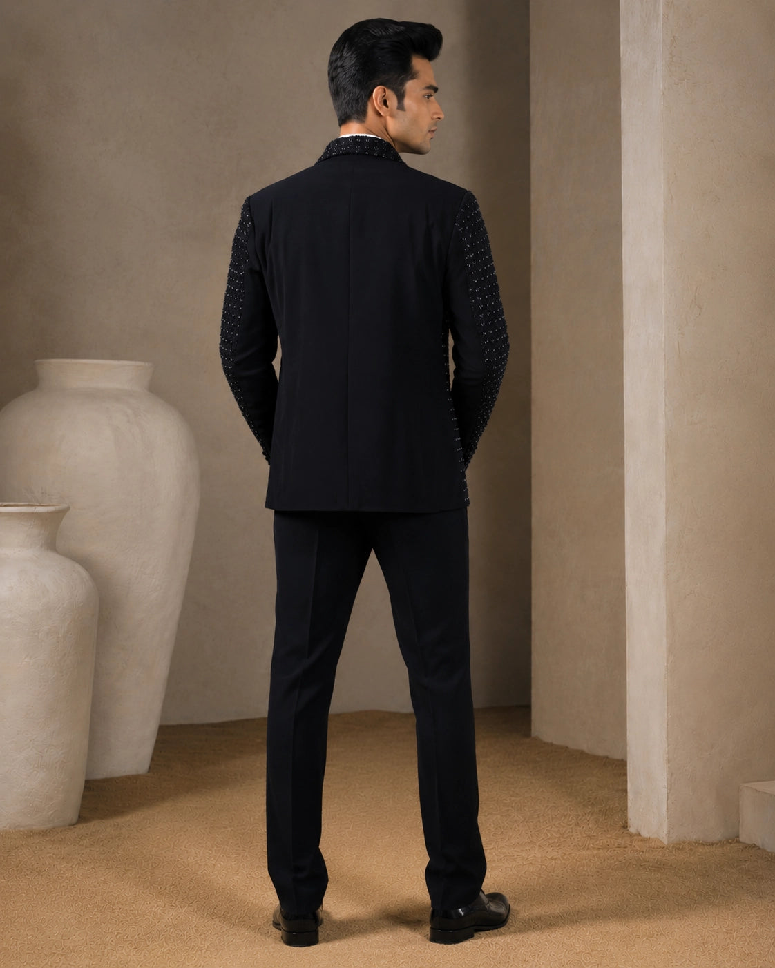 A classic navy taxido suit, perfect for formal events and special occasions.