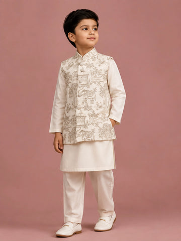 Young boy wearing an off-white embroidered bandhgala waistcoat over a kurta pajama.
