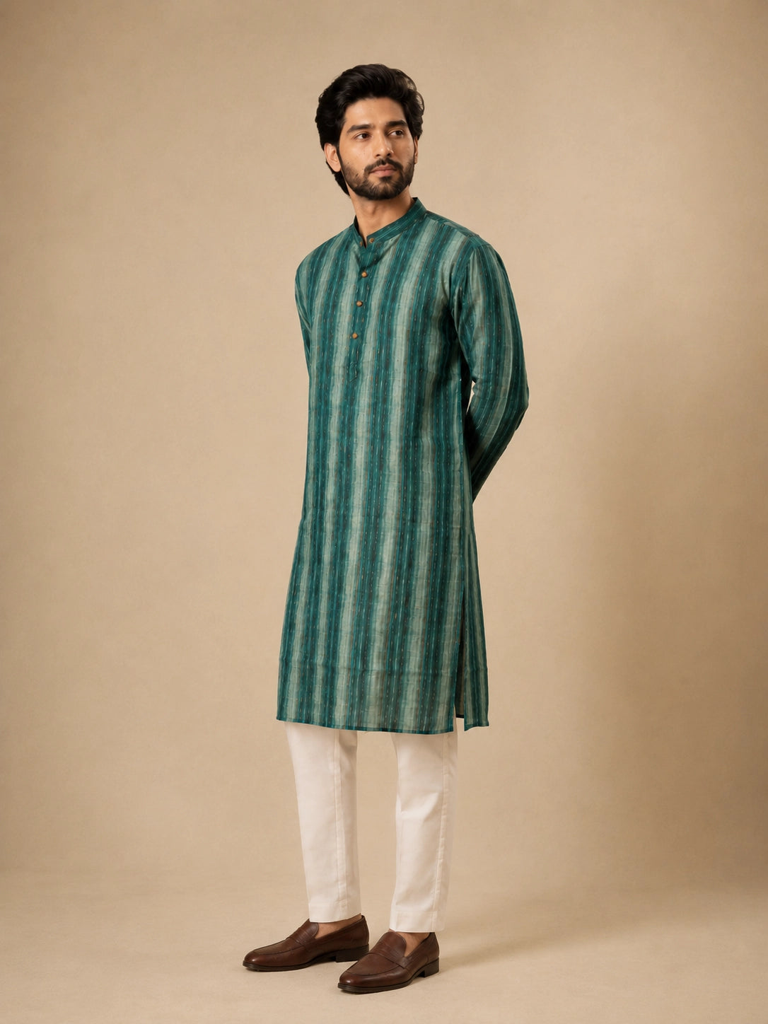 Man wearing a C.Teal striped kurta with white pajama and brown loafers.