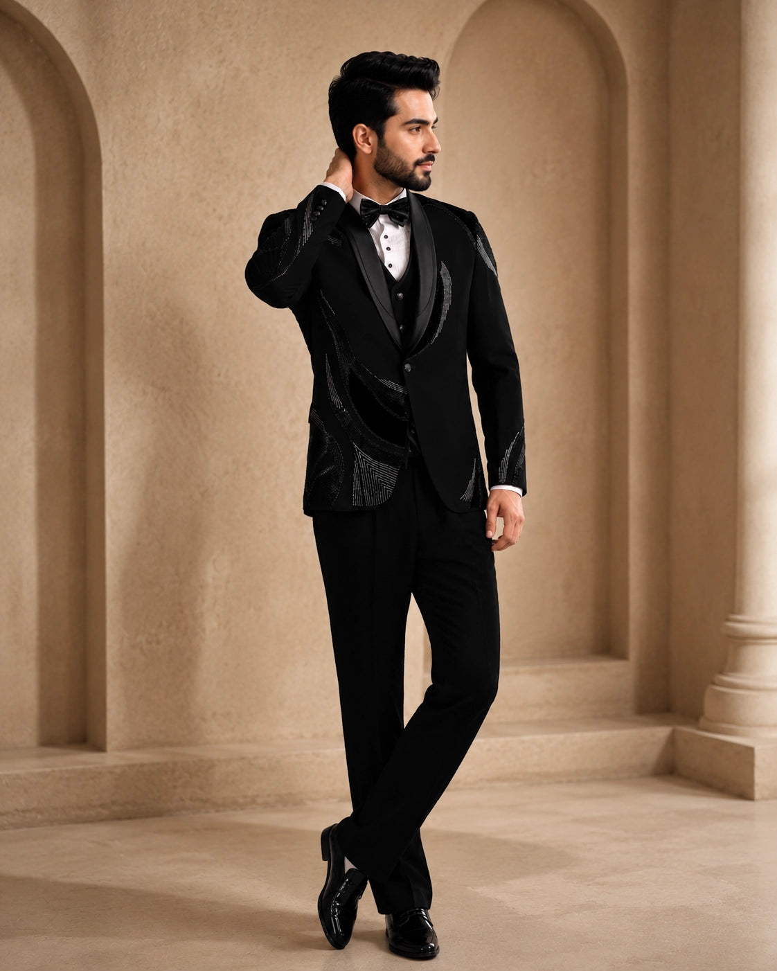 A classic black taxido suit for men, showcasing a sharp silhouette and elegant formal wear.