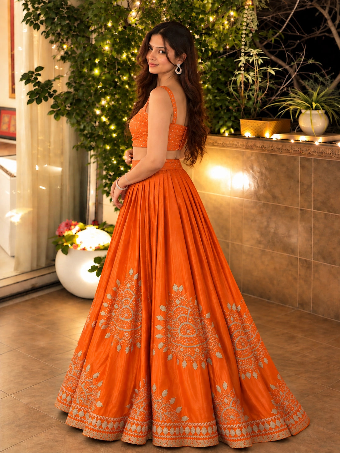 Woman in elegant rust embroidered lehenga choli set with matching dupatta.