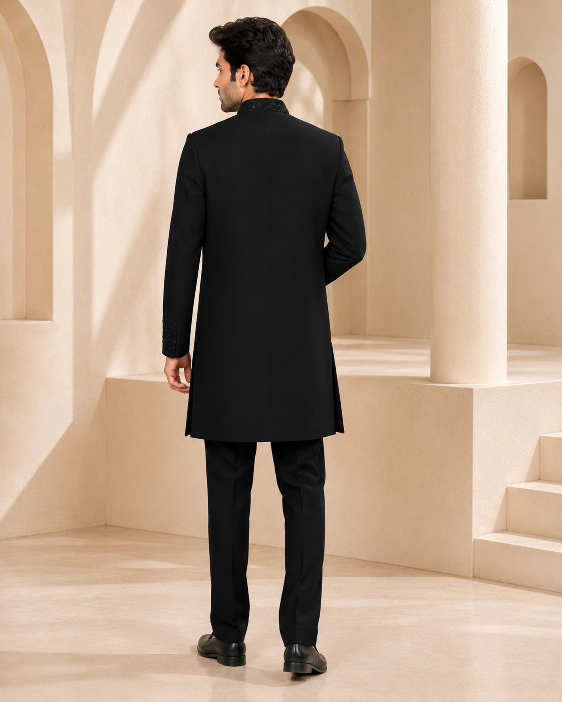 Man wearing a stylish black Indo-Western suit, perfect for formal events and celebrations.