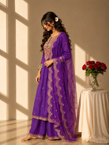 Elegant purple RM palazzo suit featuring detailed gold embroidery and a sheer scalloped dupatta.