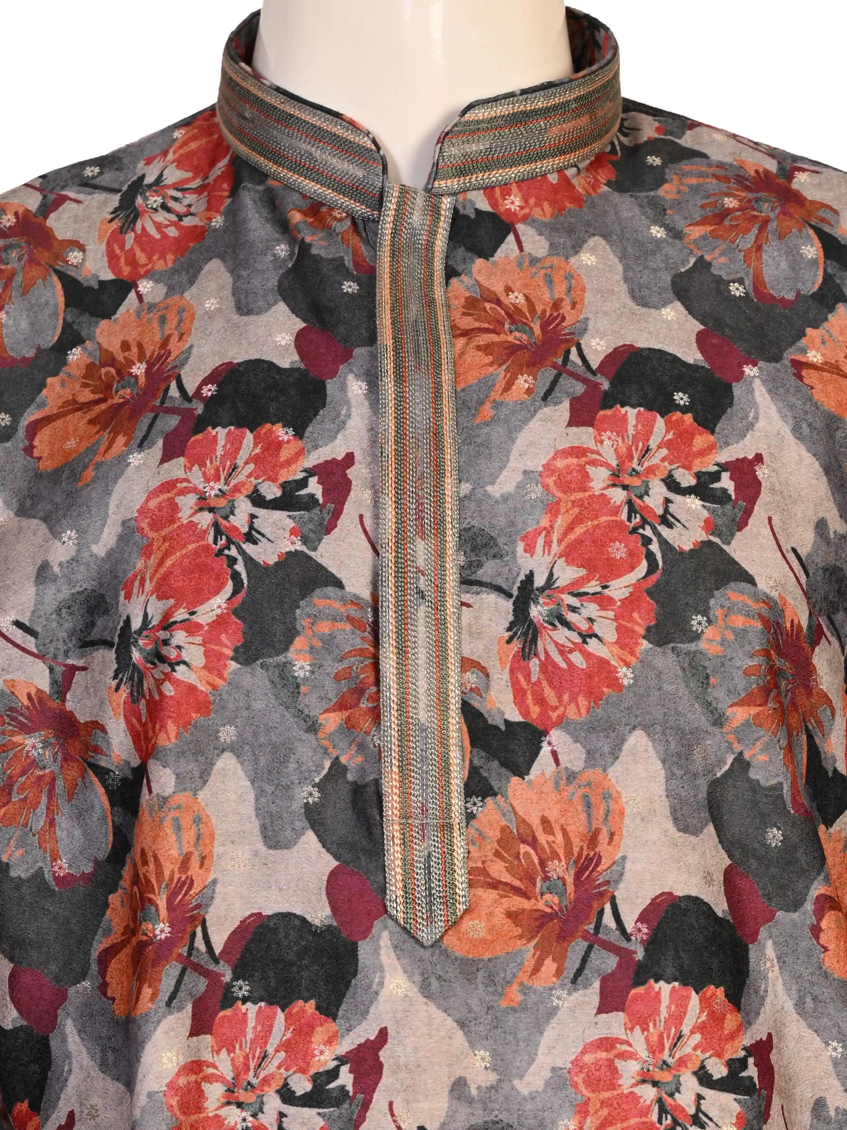 Man wearing a multi-color floral print kurta with an embellished neckline and cream churidar pants.