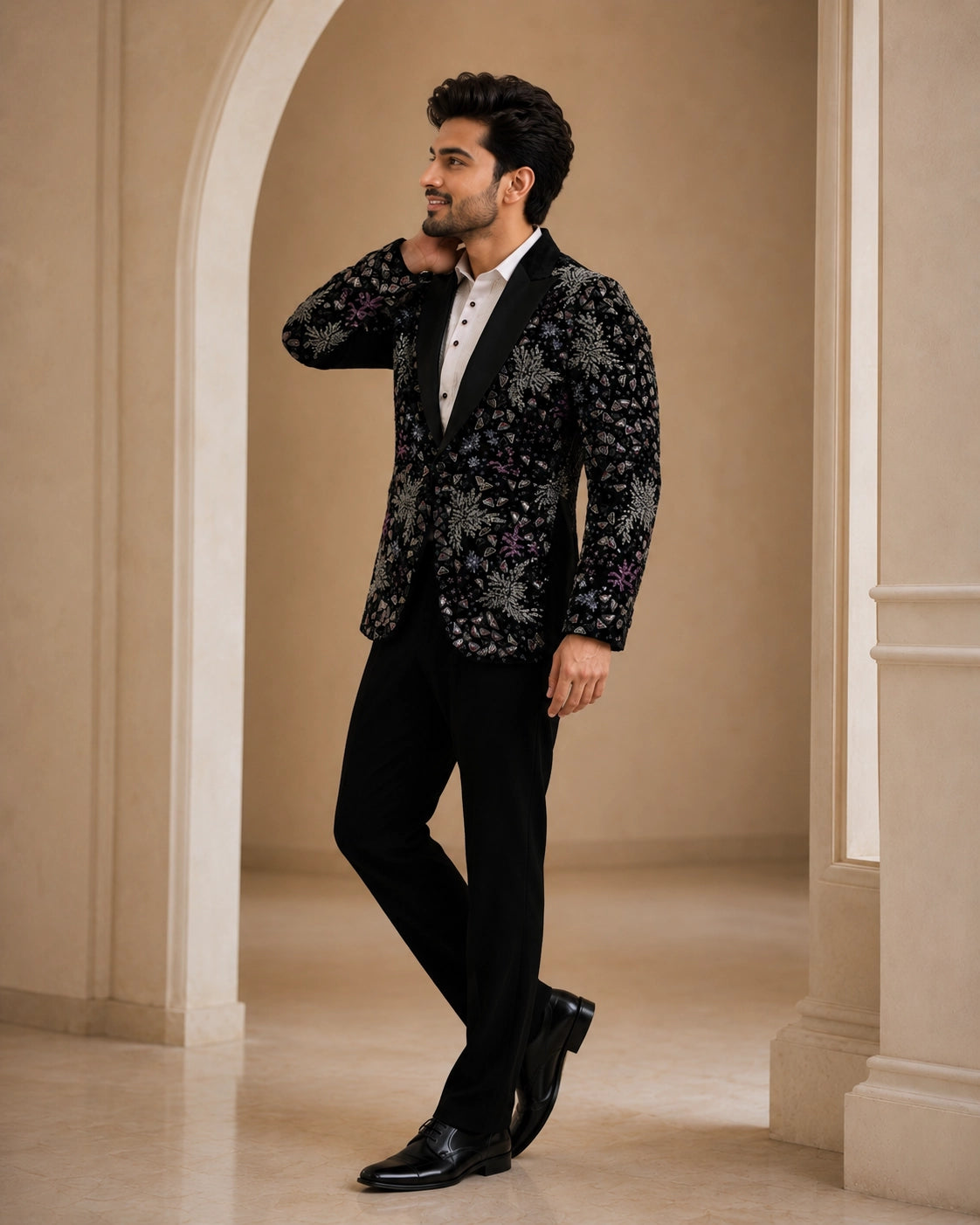 A classic black taxido suit, perfect for formal events, showcasing elegant tailoring and a sophisticated look.