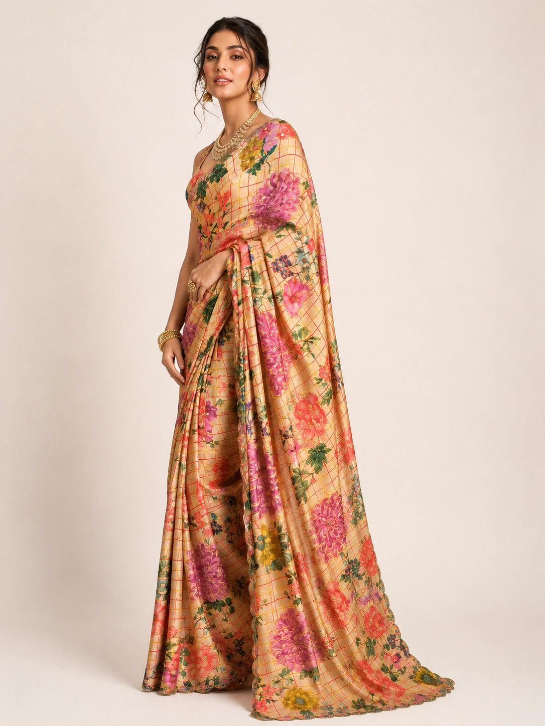 Woman elegantly draped in a cream  floral saree with vibrant multi-color prints.