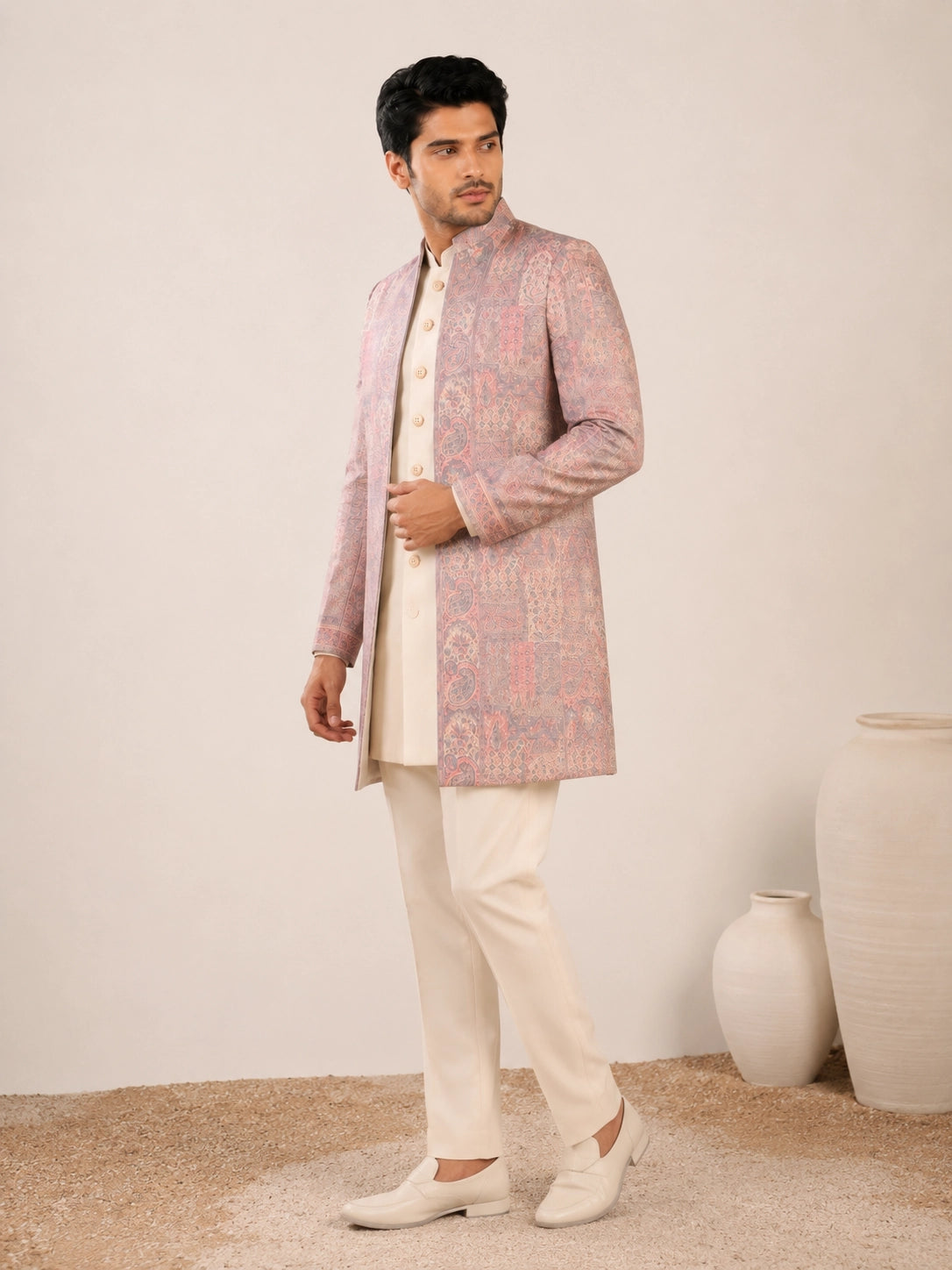 Model wearing an elegant purple Indowestern gown with delicate embroidery, front view.