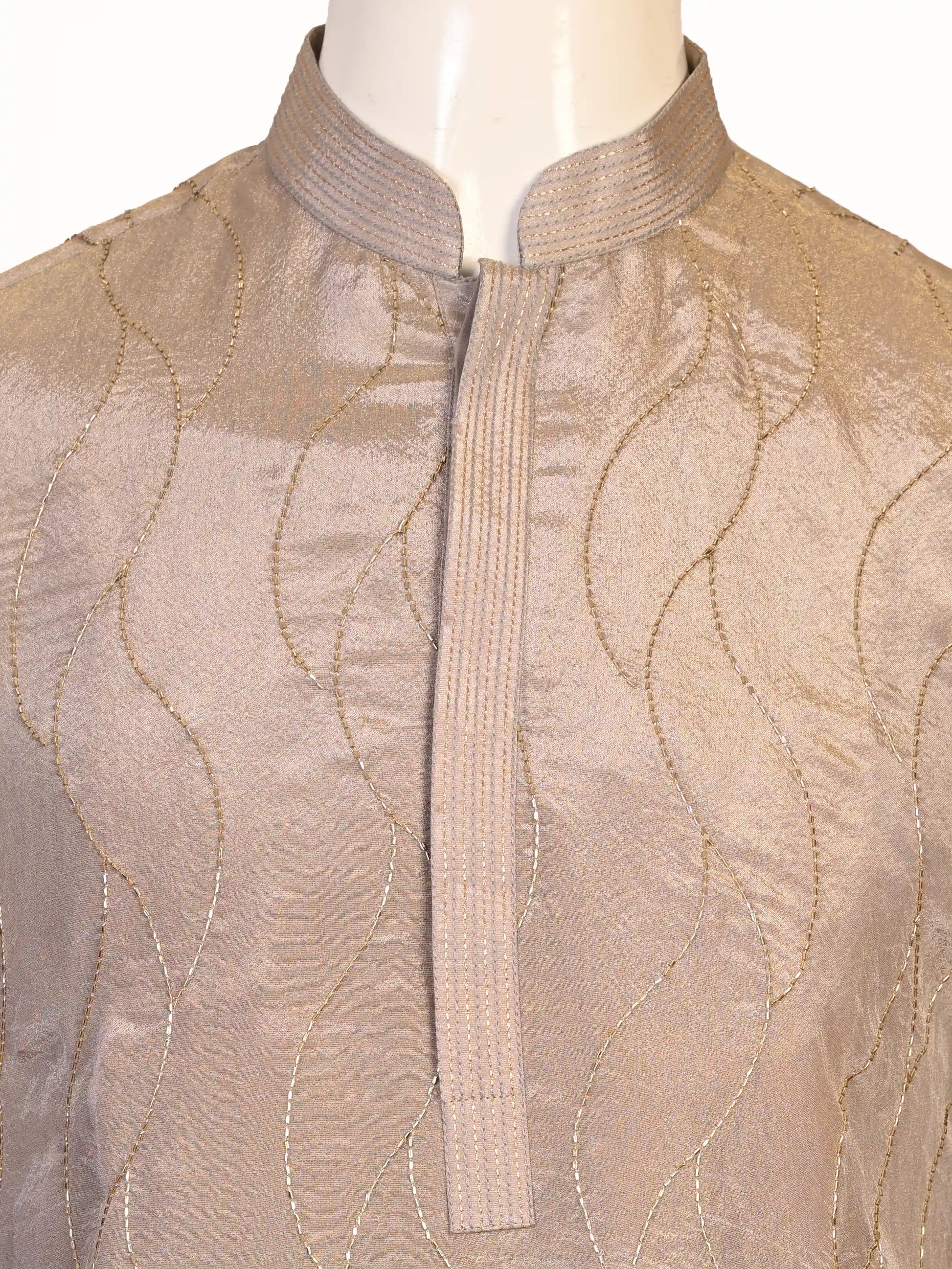 Man wearing a multi-color textured kurta with shimmering accents and cream pants, ready for festive occasions.