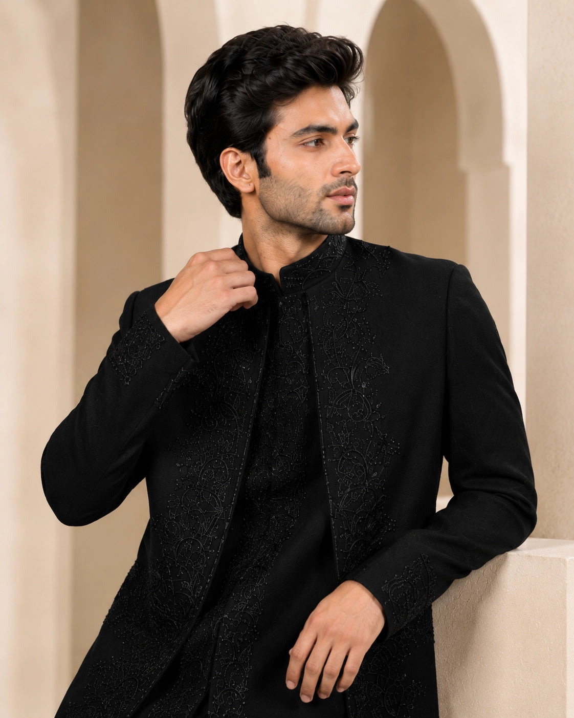 Man wearing a stylish black Indo-Western suit, perfect for formal events and celebrations.