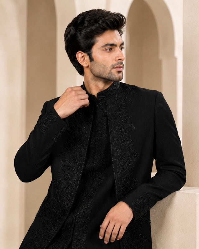 Man wearing a stylish black Indo-Western suit, perfect for formal events and celebrations.
