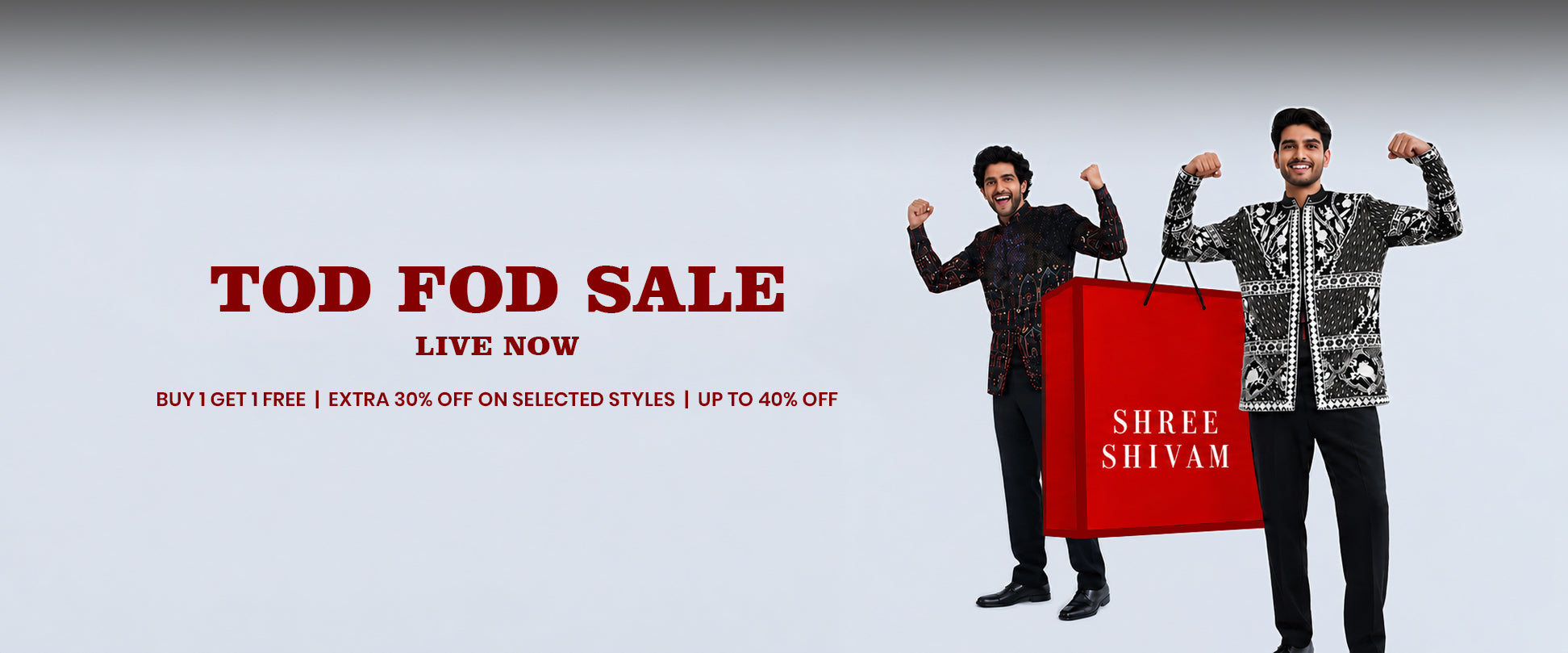 Two men modeling traditional Indian patterned jackets stand behind a large red shopping bag with the brand name 'SHREE SHIVAM' on a light gray background. Promotional text at the top reads 'TOD FOD SALE LIVE NOW'.slider_item_8GTEj7